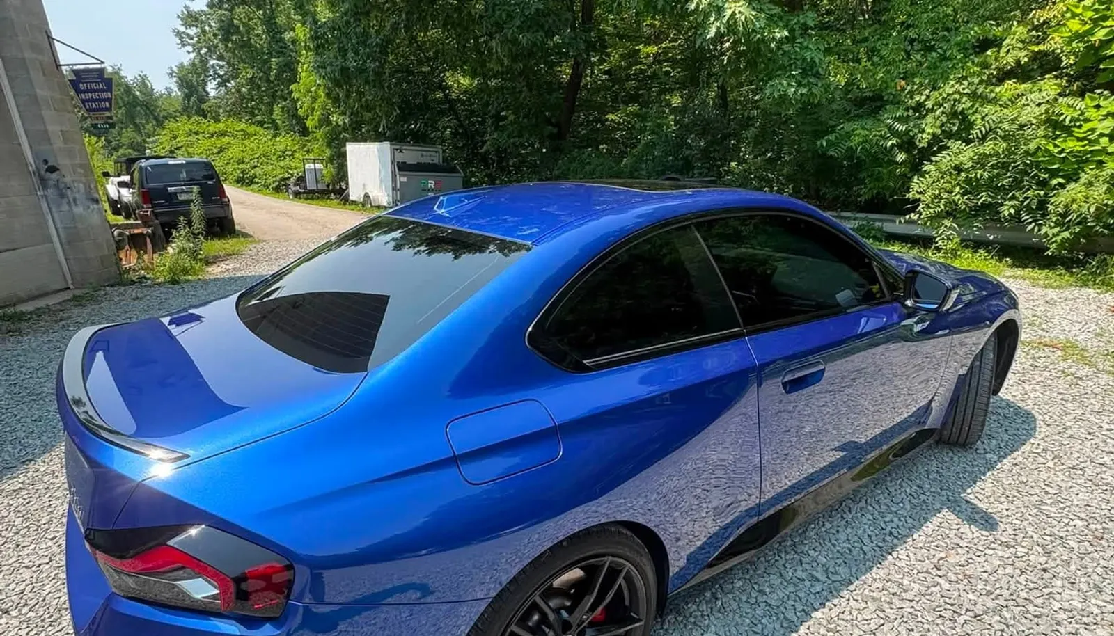 The rear of a blue Subaru WRX with tinted glass at Mr. Tint in Plum, Pennsylvania