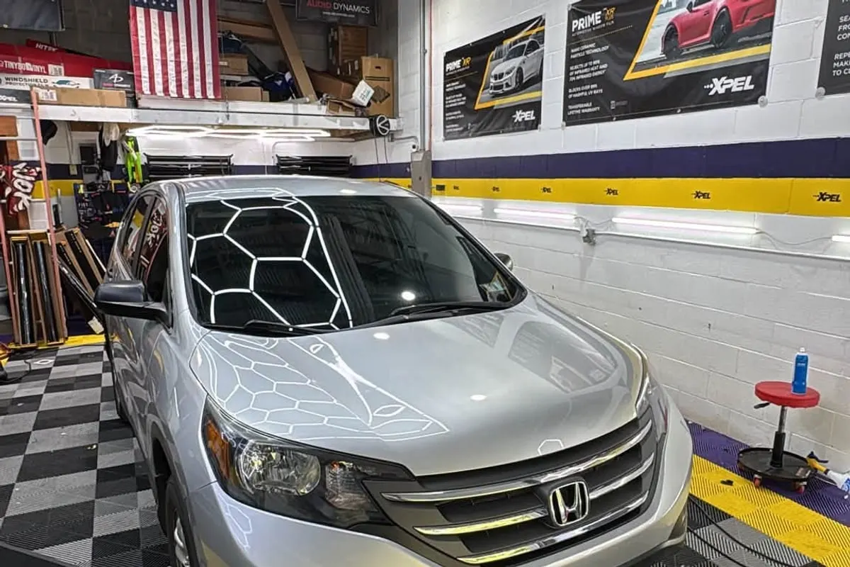 A silver Honda CR-V with tinted windows at Mr. Tint