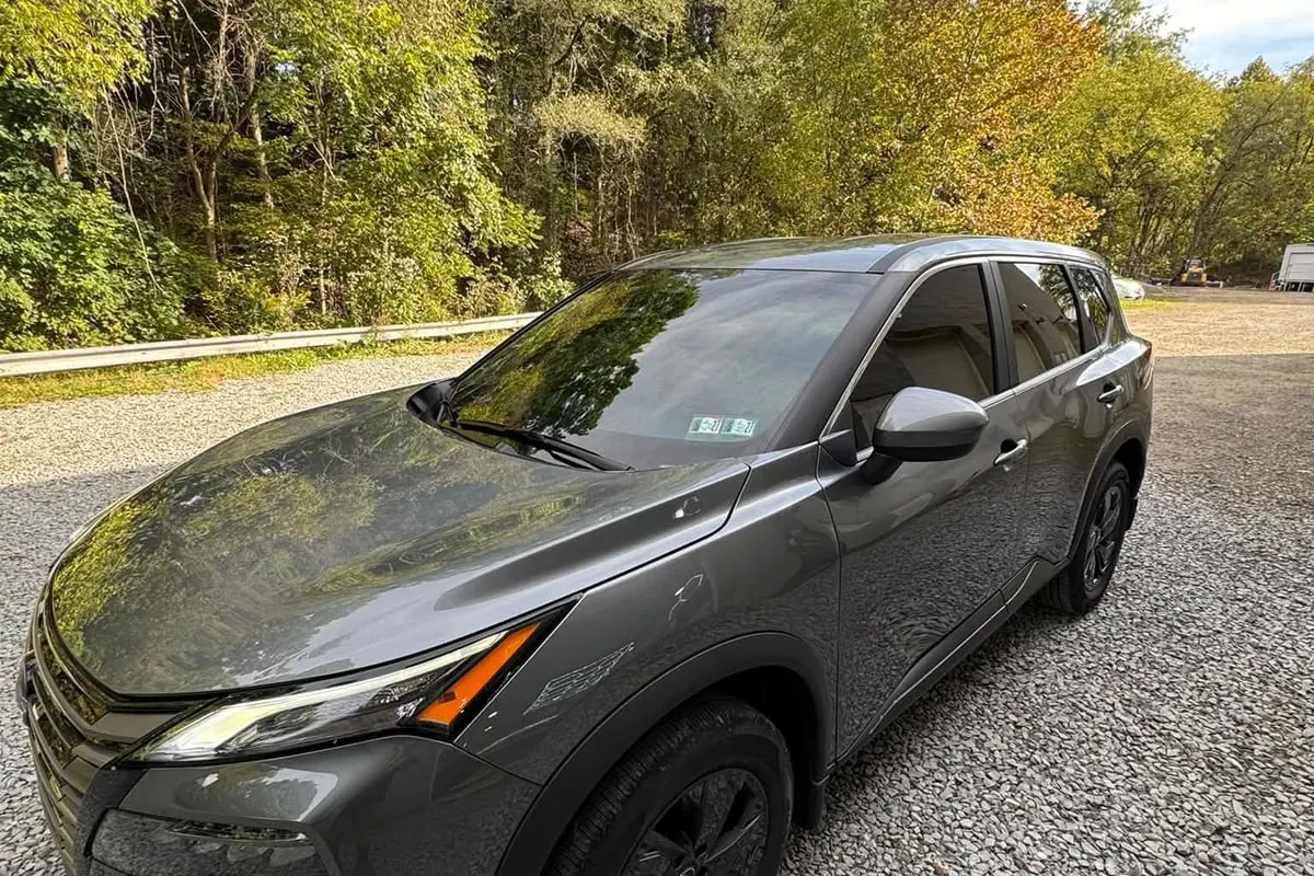 A grey Jeep Grand Cherokee with tinted windows at Mr. Tint