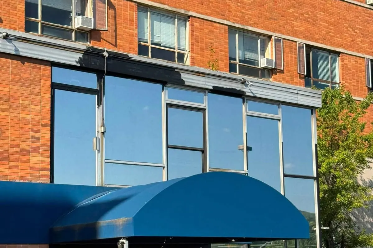 Large filmed glazing panels above a commercial entrance in Pittsburgh