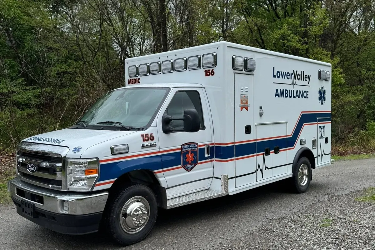 A LowerValley Ambulance wrapped with its blue and white livery by Mr. Tint