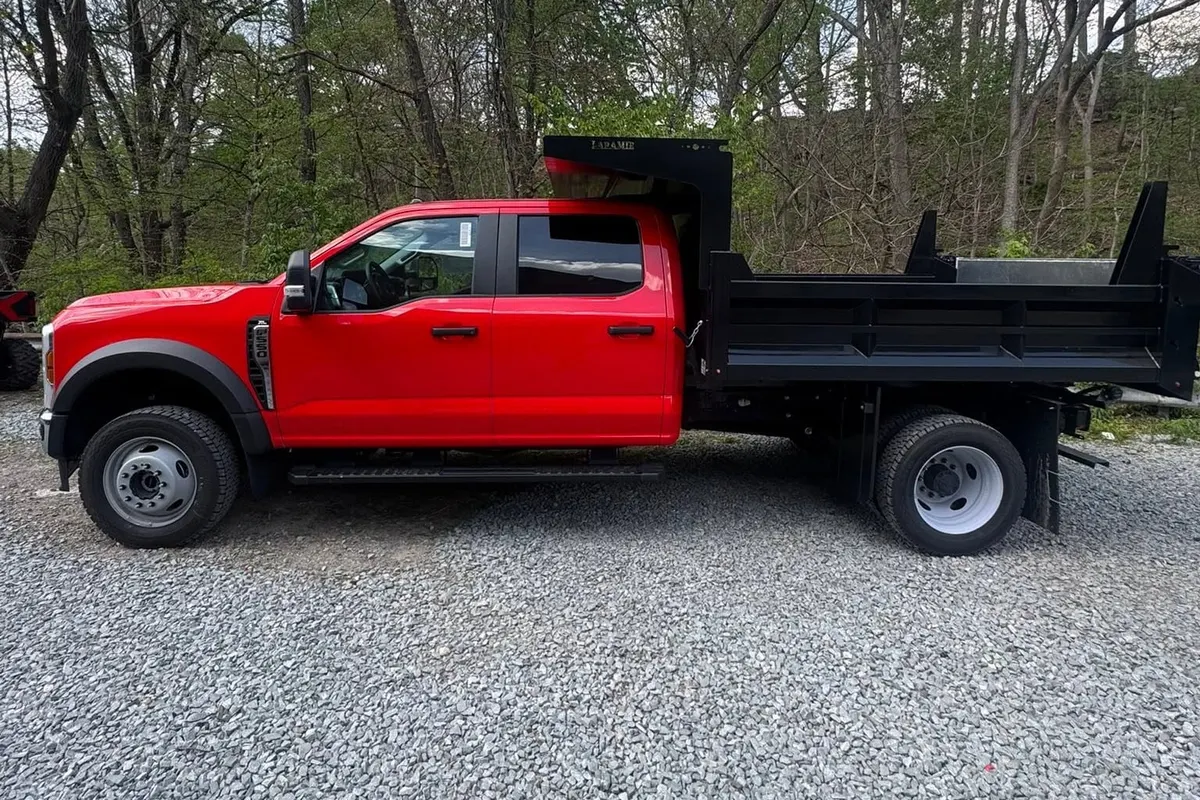 The side of a red Ford F-550 dump truck after wrapping at Mr. Tint