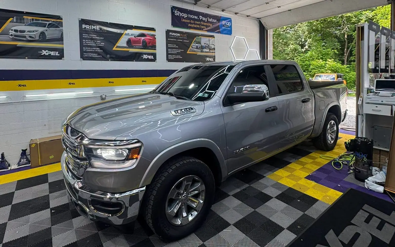 A pickup on the XPEL-branded floor of the Mr. Tint installation bay in Plum, Pennsylvania
