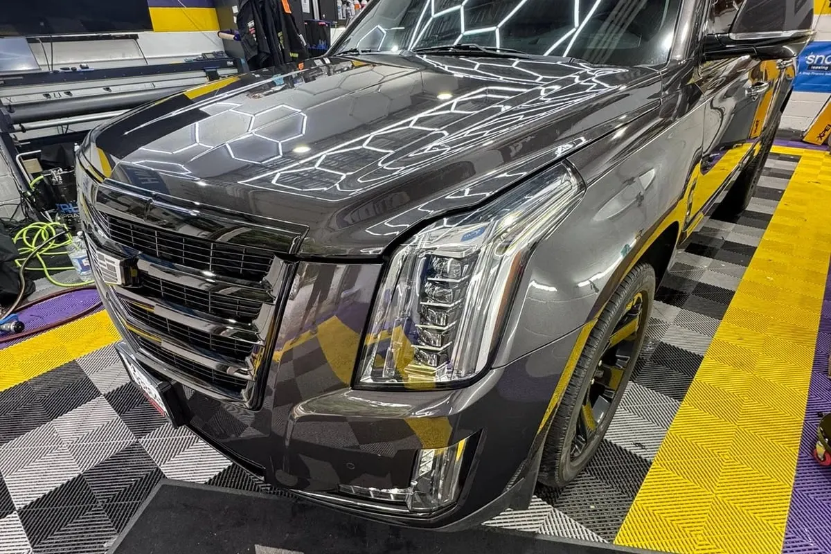 A grey Cadillac Escalade protected with paint protection film at Mr. Tint