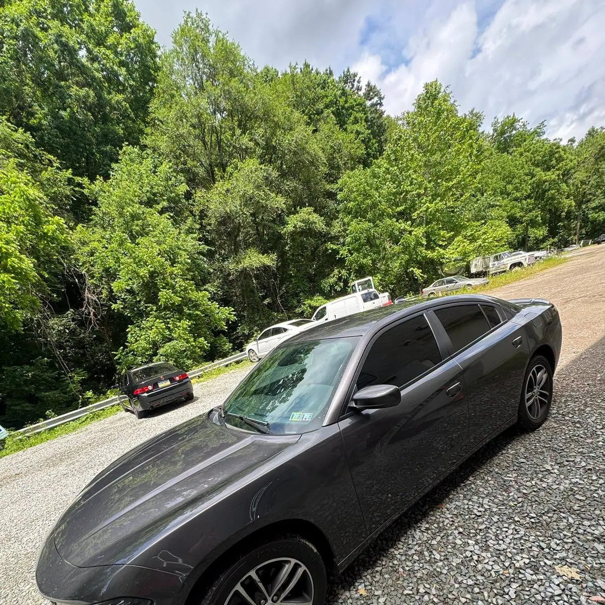 A grey Dodge Charger with tinted glass at Mr. Tint in Plum, Pennsylvania