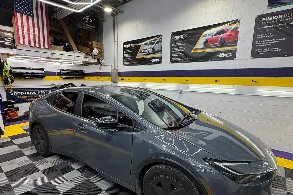 A grey Toyota Prius inside the Mr. Tint installation bay
