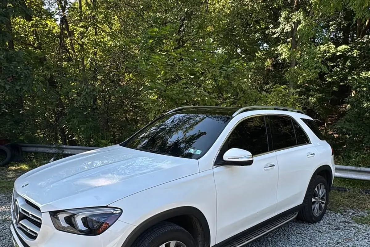 A white Mercedes-Benz GLE with tinted glass at Mr. Tint in Plum, Pennsylvania