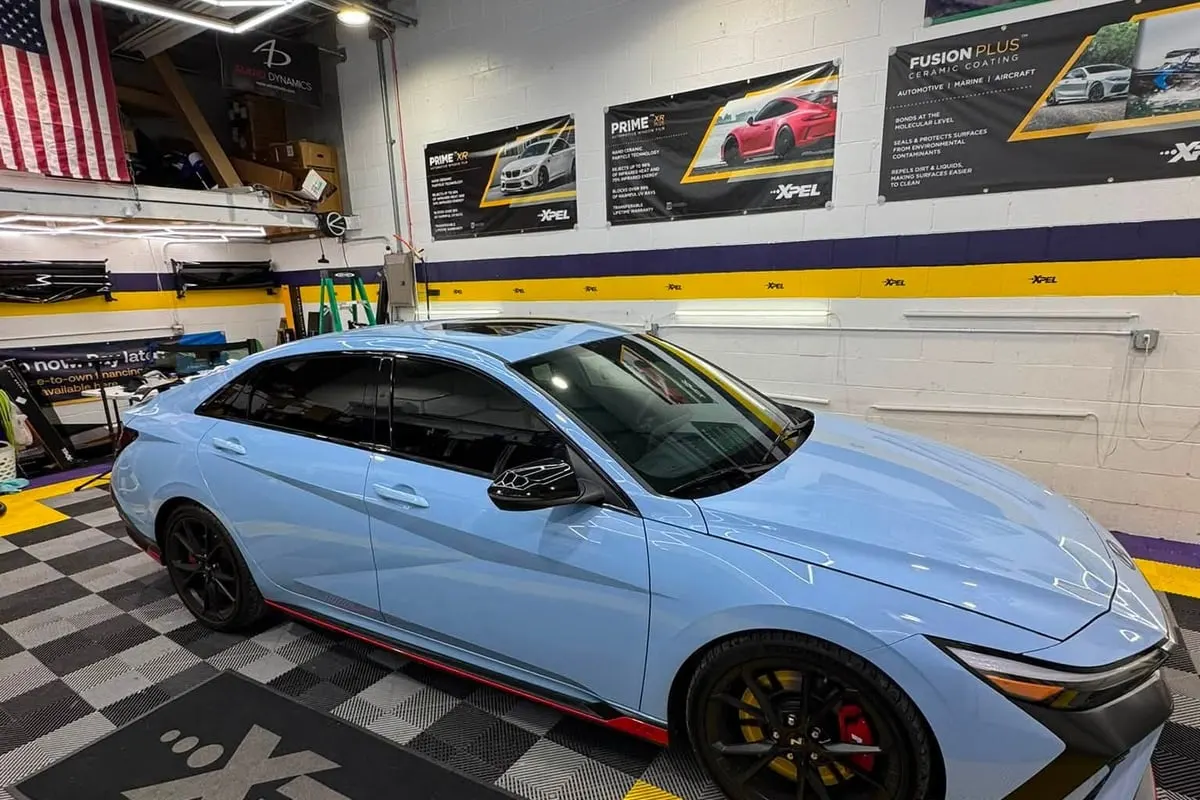 A blue Hyundai Elantra N with tinted glass at Mr. Tint
