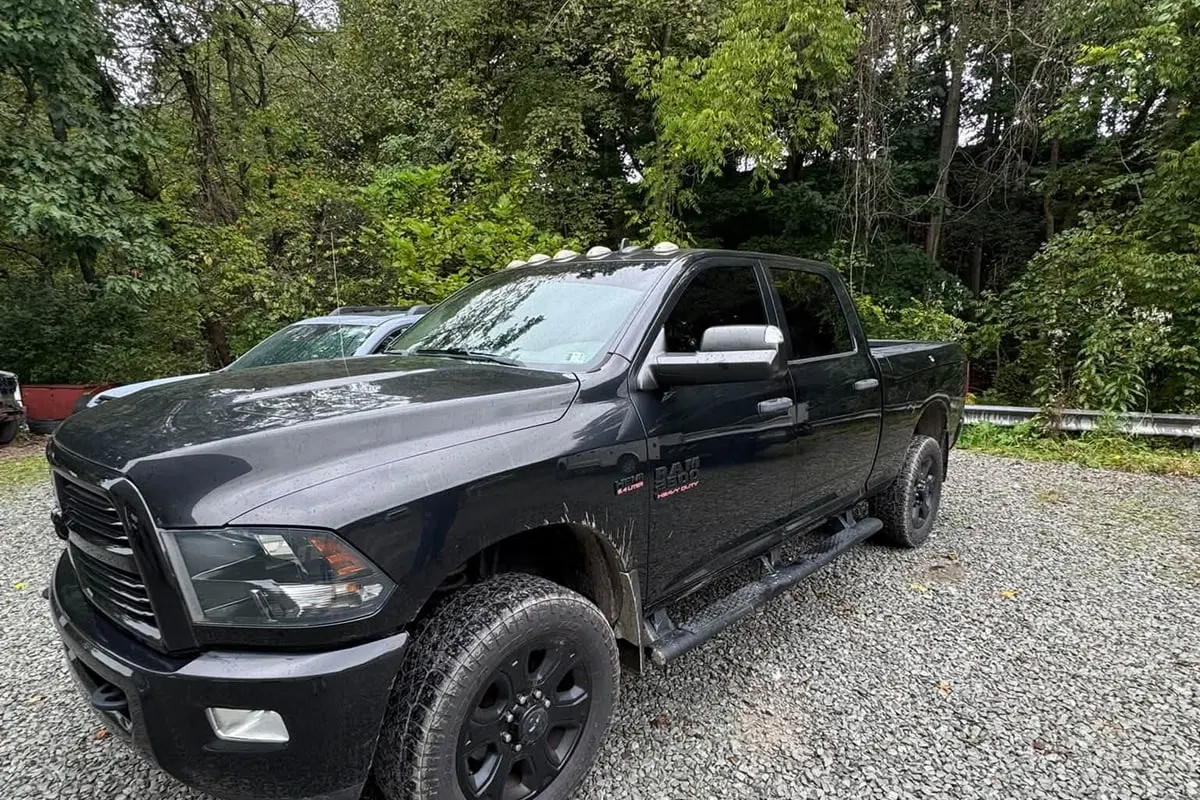 A black Ram 2500 pickup with tinted windows at Mr. Tint