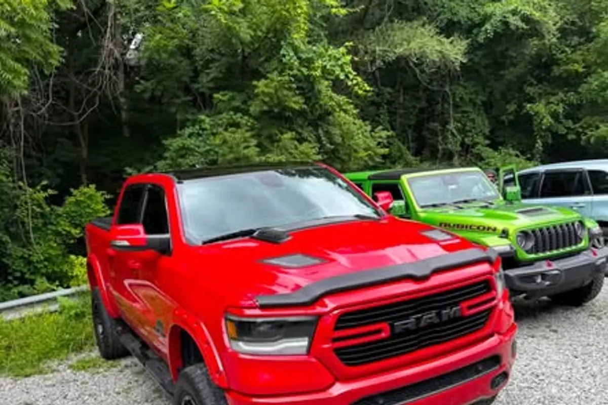 A red wrapped Ram 1500 pickup at Mr. Tint